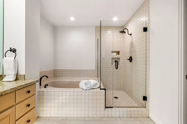 a bathroom with a shower bathtub and sink