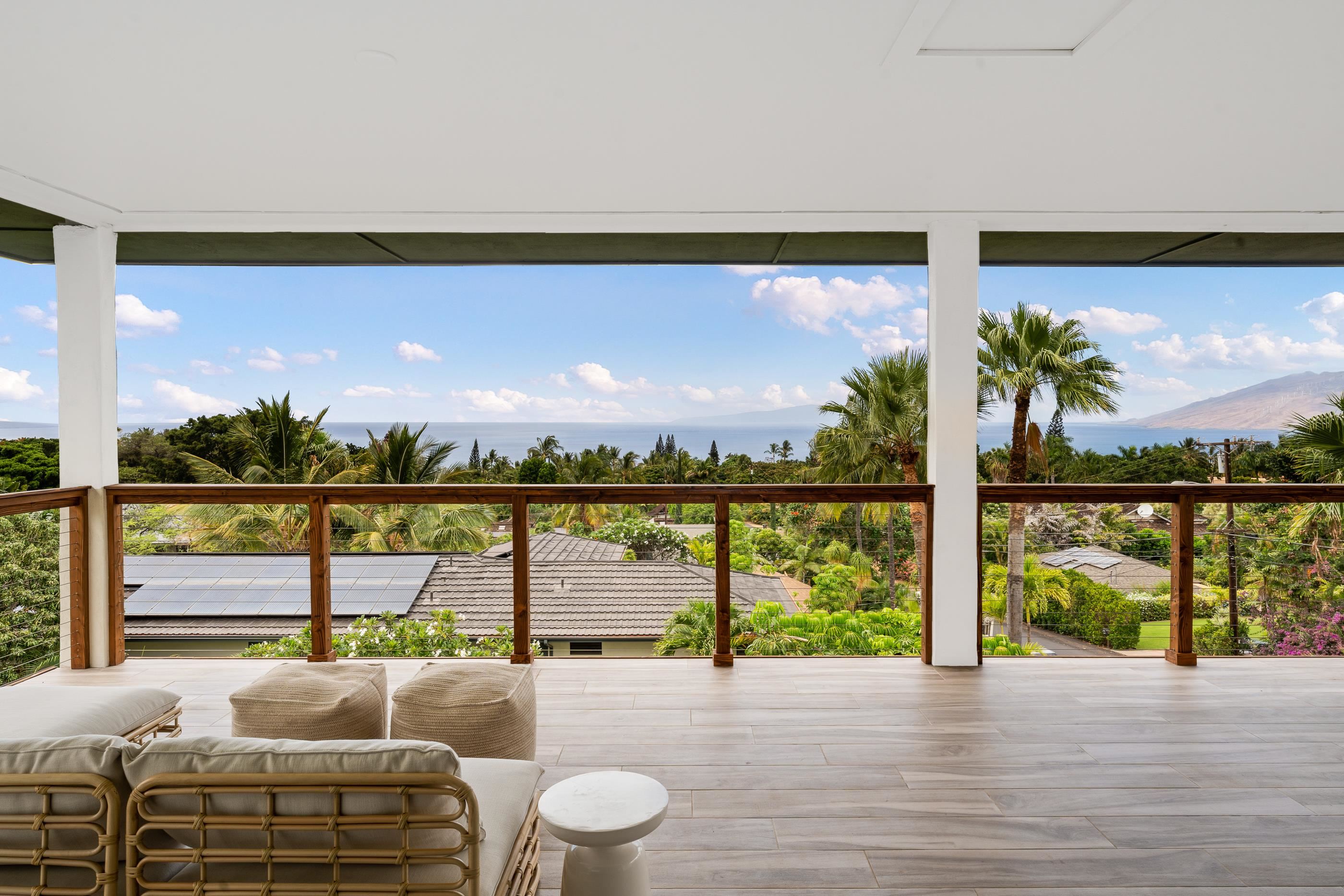 a living room with furniture city view and a large window