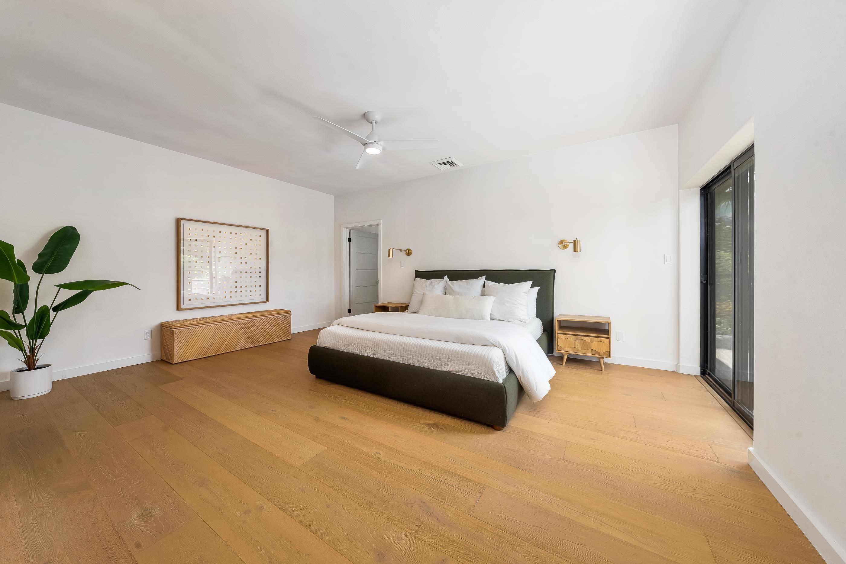 820 Kupulau Drive Kihei, HI 96753 - Photo 15 of 50 a bedroom with a bed and a couch