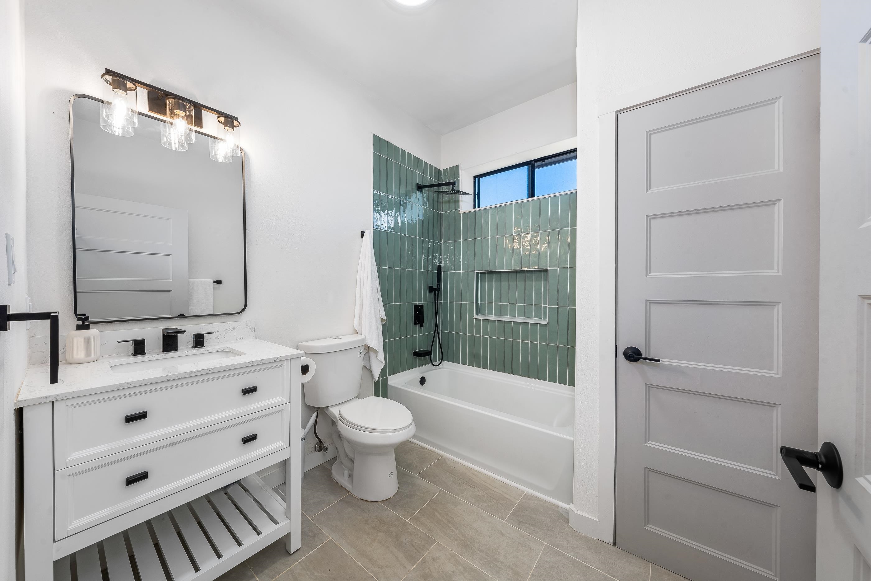 820 Kupulau Drive Kihei, HI 96753 - Photo 22 of 50 a bathroom with a bathtub shower sink vanity and toilet