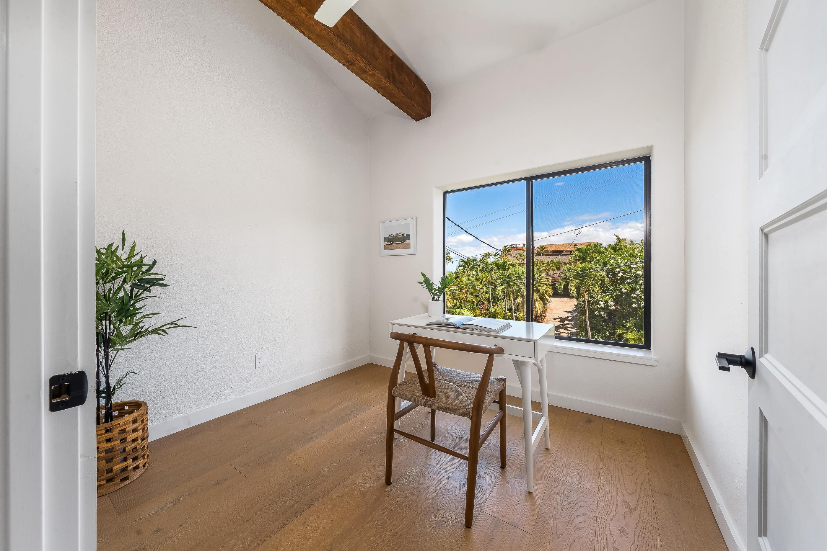 820 Kupulau Drive Kihei, HI 96753 - Photo 24 of 50 a view of a workspace with furniture and a potted plant