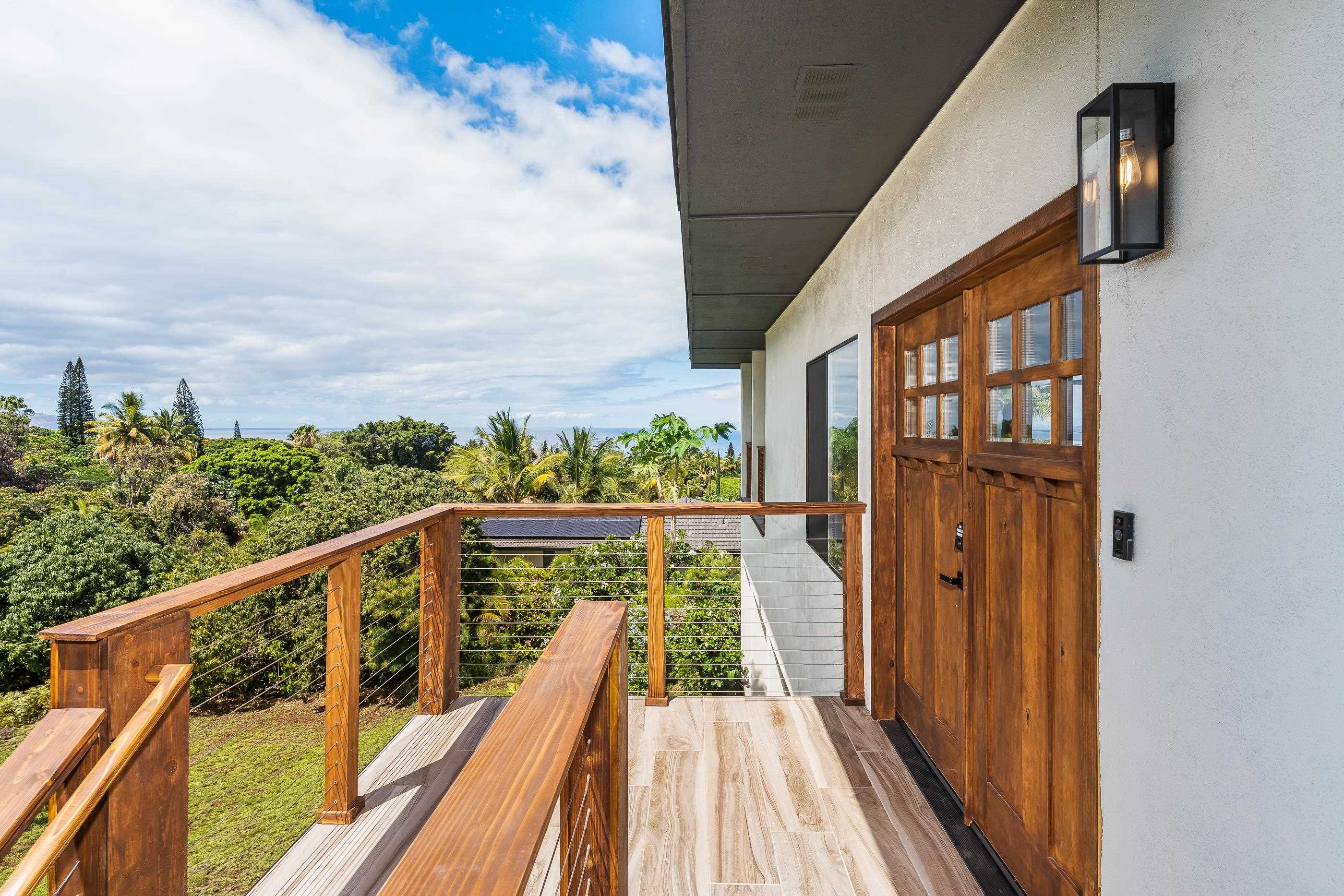 820 Kupulau Drive Kihei, HI 96753 - Photo 25 of 50 a view of balcony with wooden floor and fence