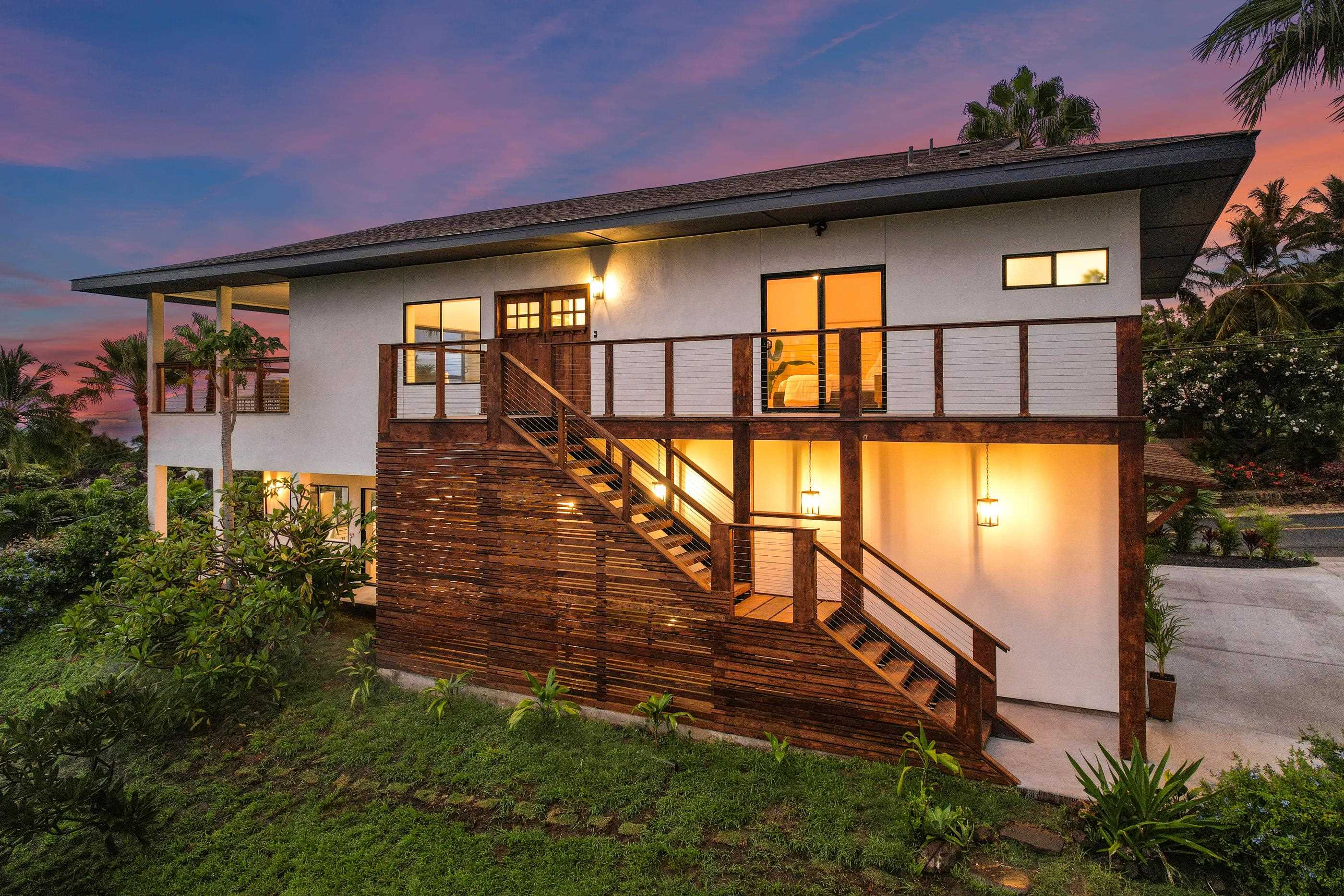 820 Kupulau Drive Kihei, HI 96753 - Photo 26 of 50 a front view of a house with a yard