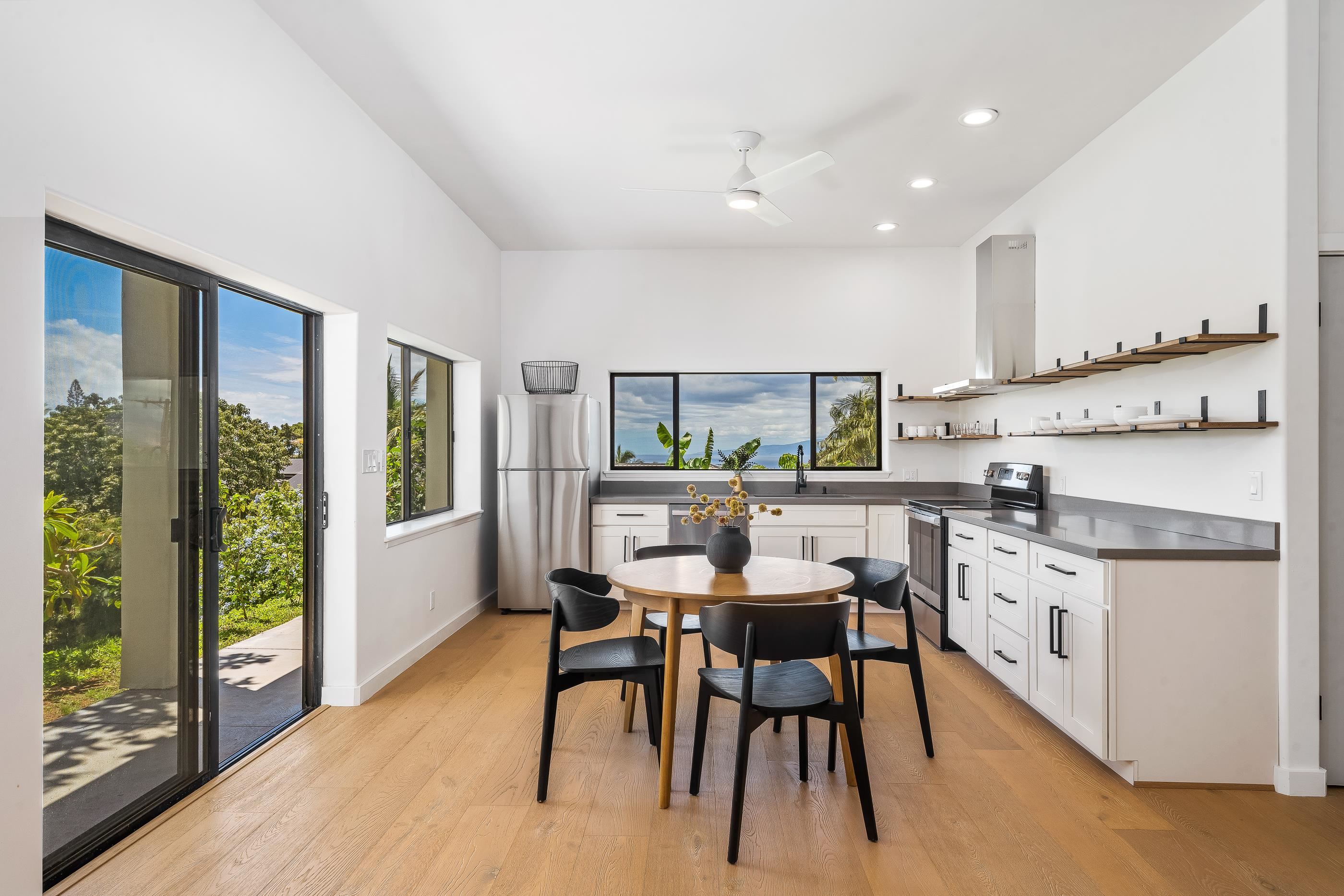 820 Kupulau Drive Kihei, HI 96753 - Photo 31 of 50 a view of a dining room with furniture window and wooden floor