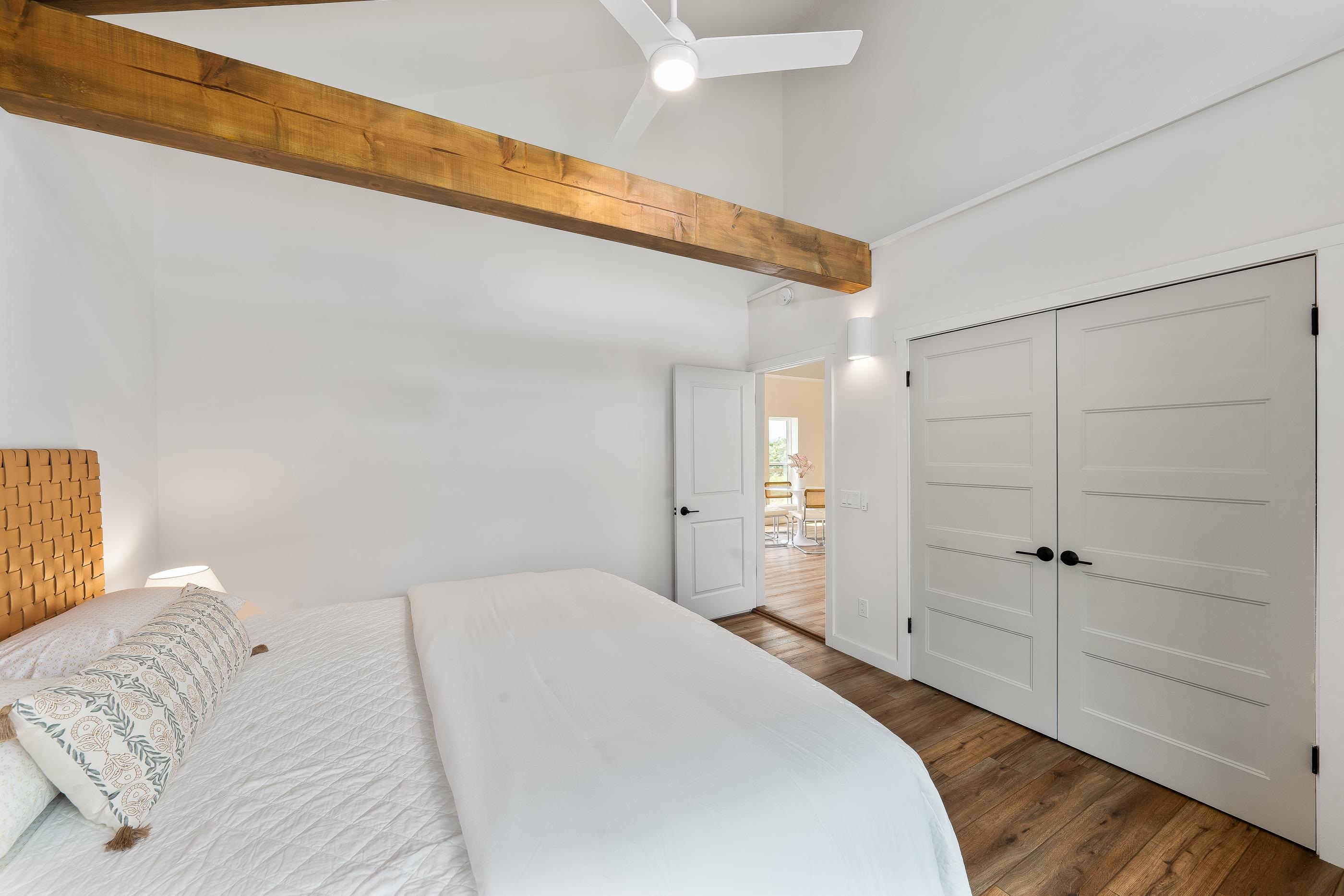 820 Kupulau Drive Kihei, HI 96753 - Photo 44 of 50 a bedroom with a bed and a walk in closet