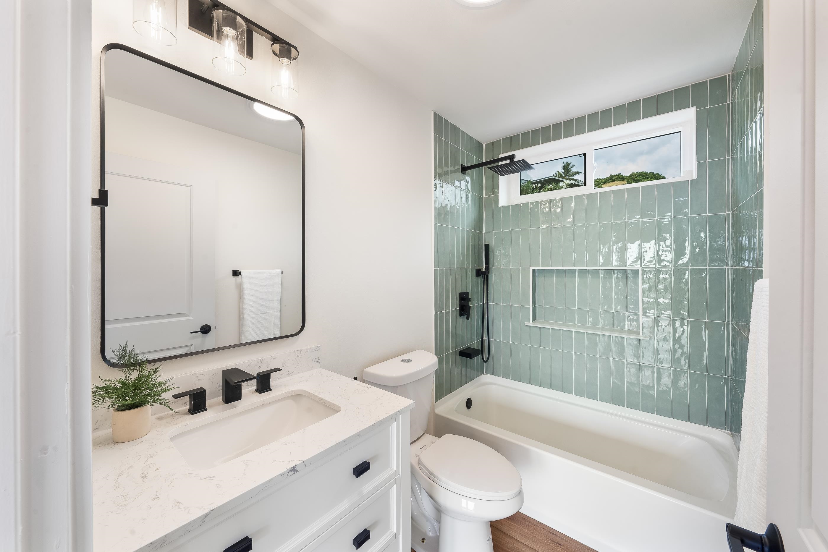 820 Kupulau Drive Kihei, HI 96753 - Photo 45 of 50 a bathroom with a bathtub shower sink vanity mirror and toilet
