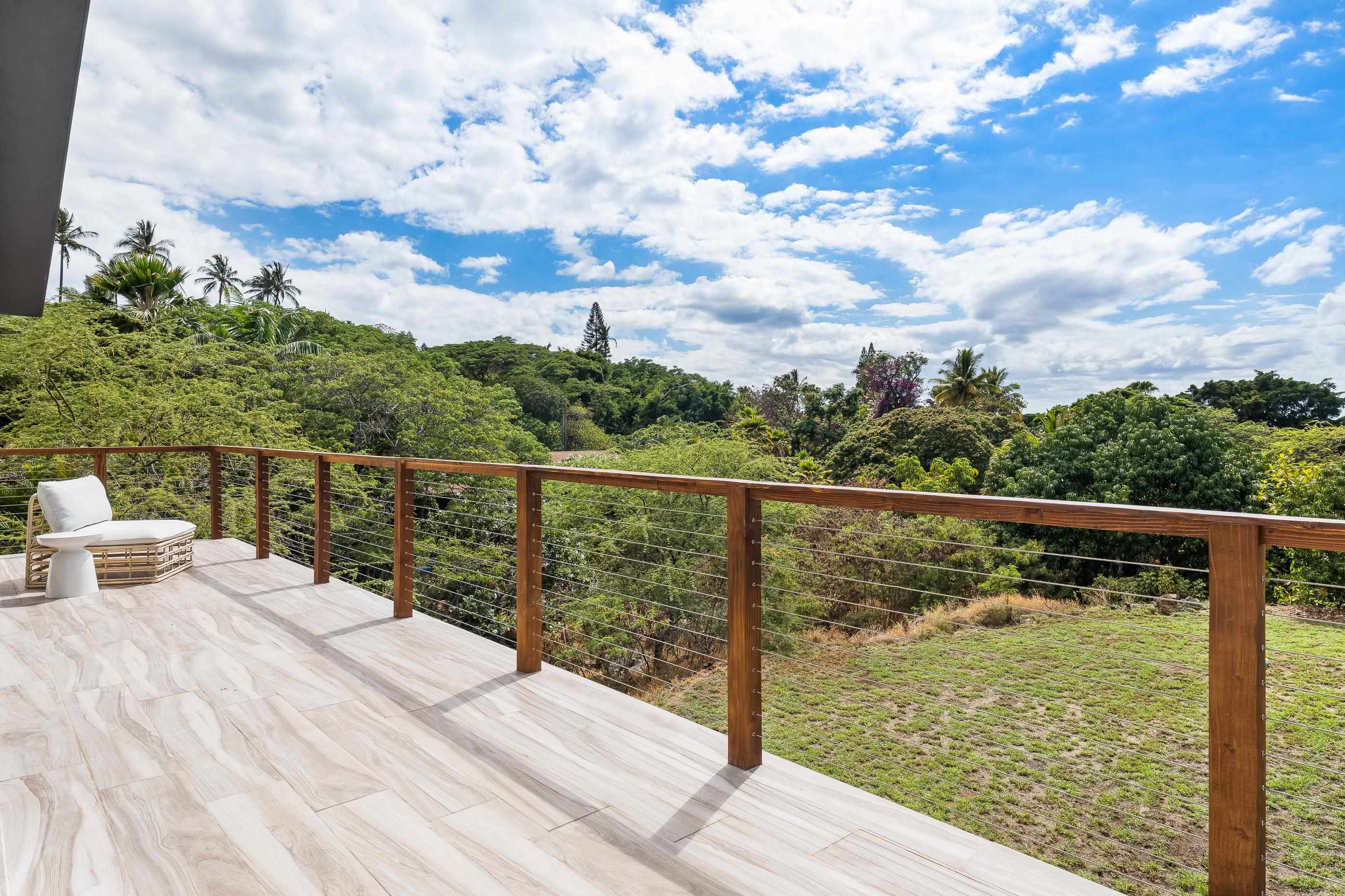 820 Kupulau Drive Kihei, HI 96753 - Photo 46 of 50 a view of a balcony with wooden floor & fence