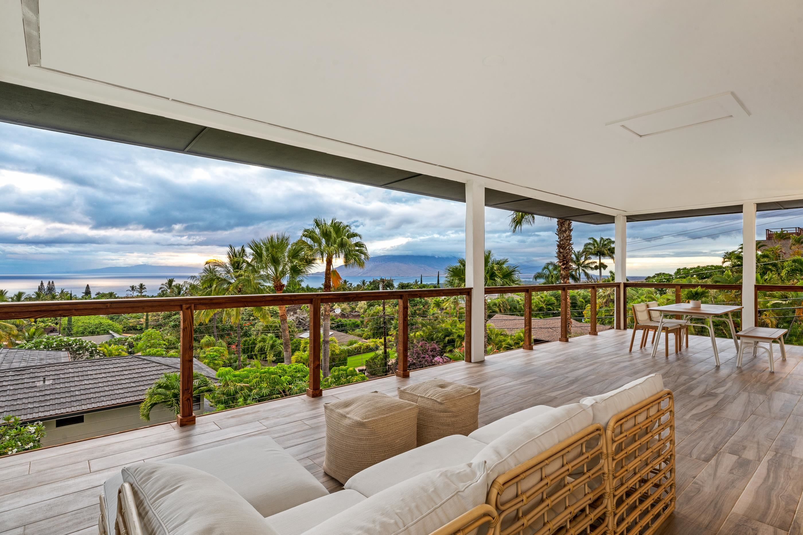 820 Kupulau Drive Kihei, HI 96753 - Photo 5 of 50 a living room with furniture tv and large window