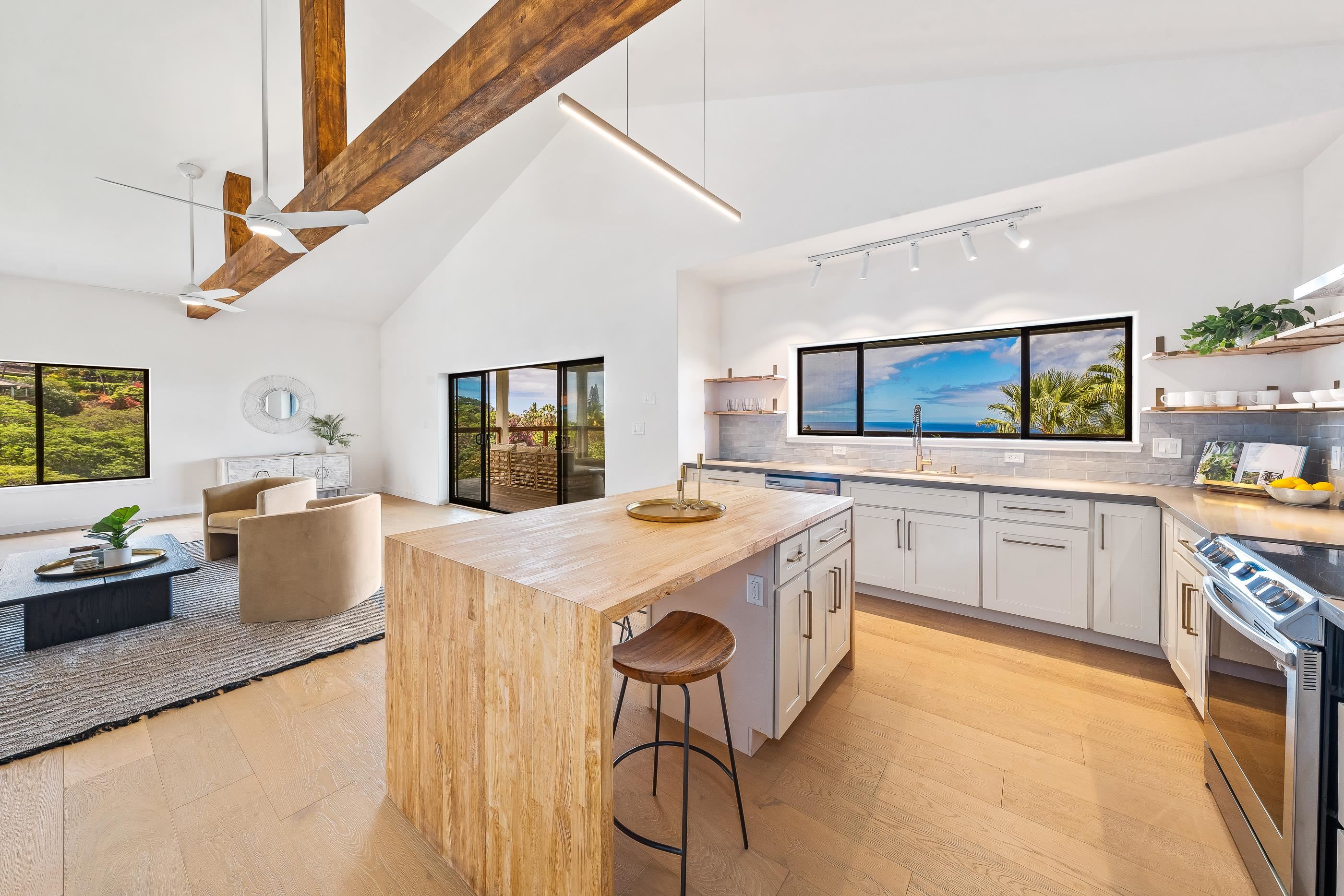 820 Kupulau Drive Kihei, HI 96753 - Photo 8 of 50 a kitchen with a stove a sink and a refrigerator