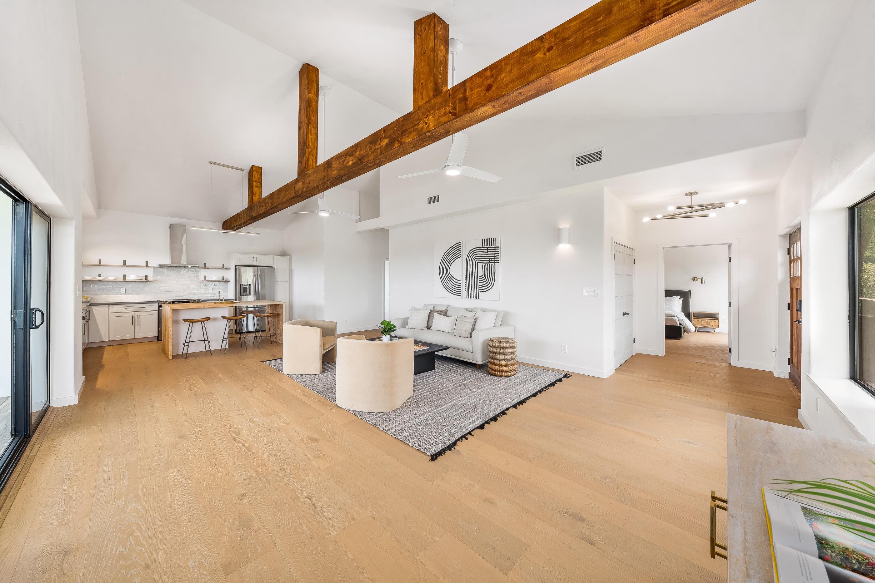 820 Kupulau Drive Kihei, HI 96753 - Photo 9 of 50 a living room with kitchen island furniture and a kitchen view