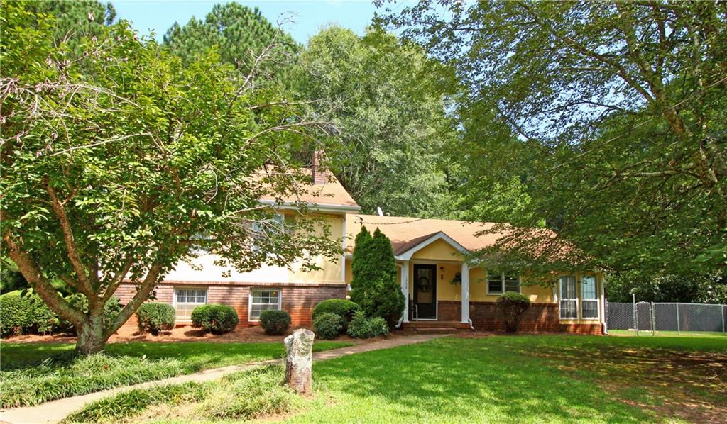 1208 Macland Road Dallas, GA 30132 - Photo 1 of 1 front view of a house with a yard