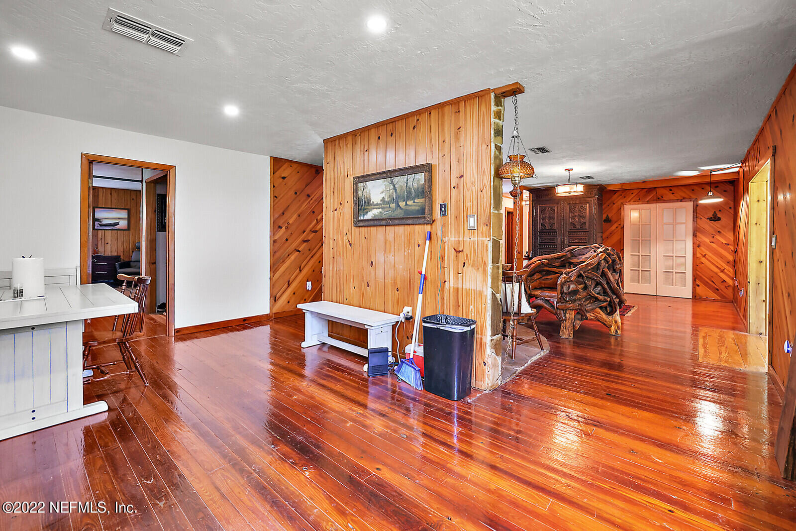 574 Clifton Road Crescent City, FL 32112 - Photo 16 of 38 a living room with furniture a wooden floor and next to a window