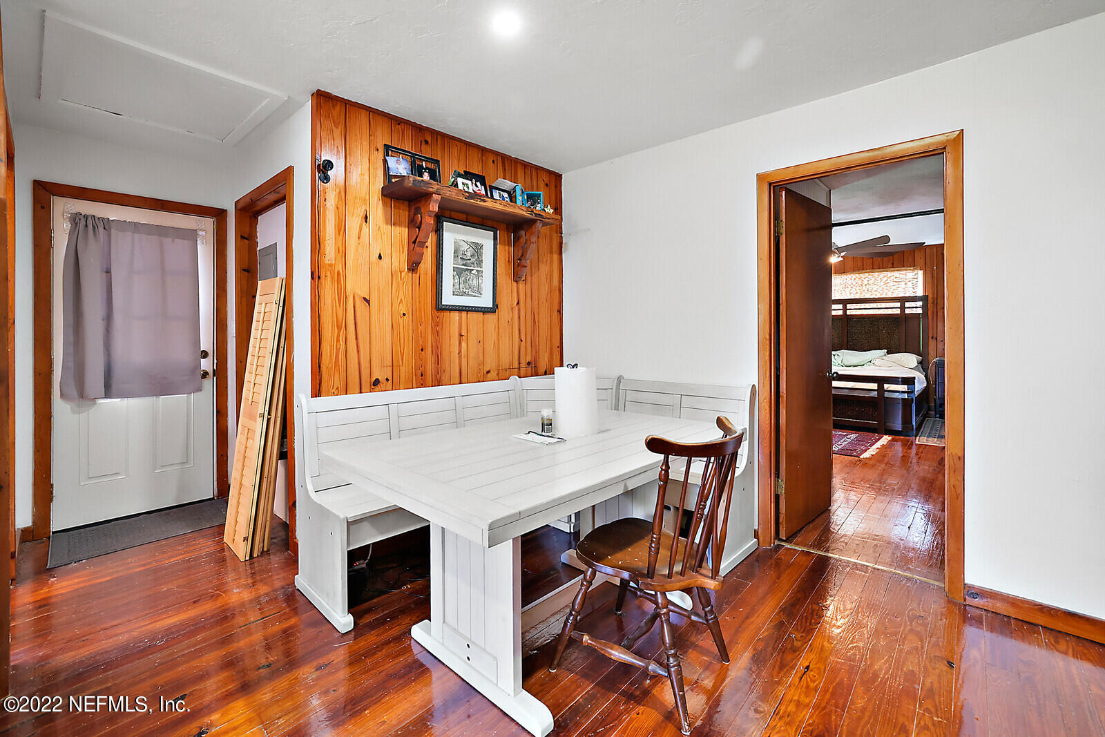 574 Clifton Road Crescent City, FL 32112 - Photo 19 of 38 a view of a dining room with furniture window and wooden floor