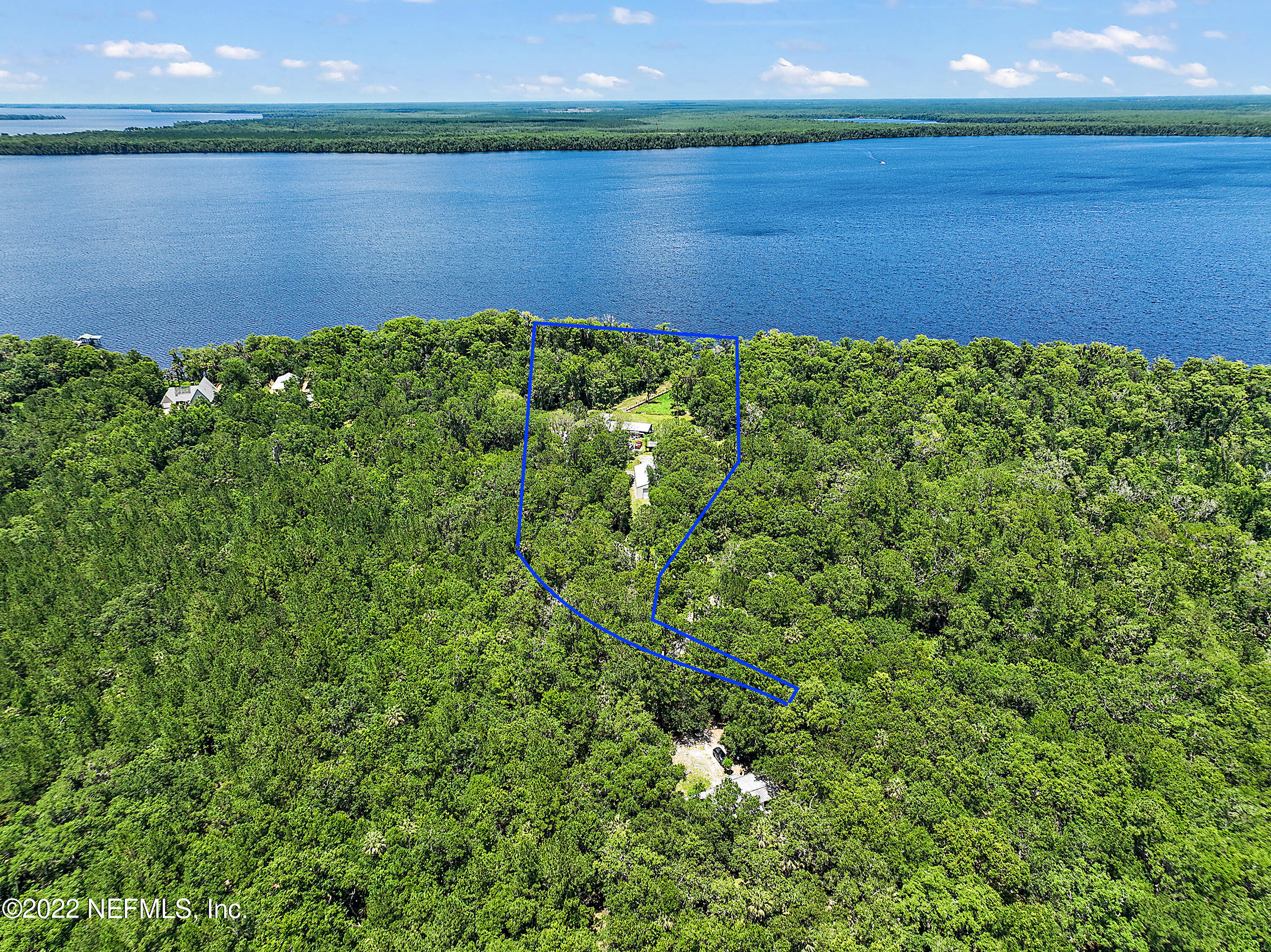 574 Clifton Road Crescent City, FL 32112 - Photo 2 of 38 a view of a lake with a yard