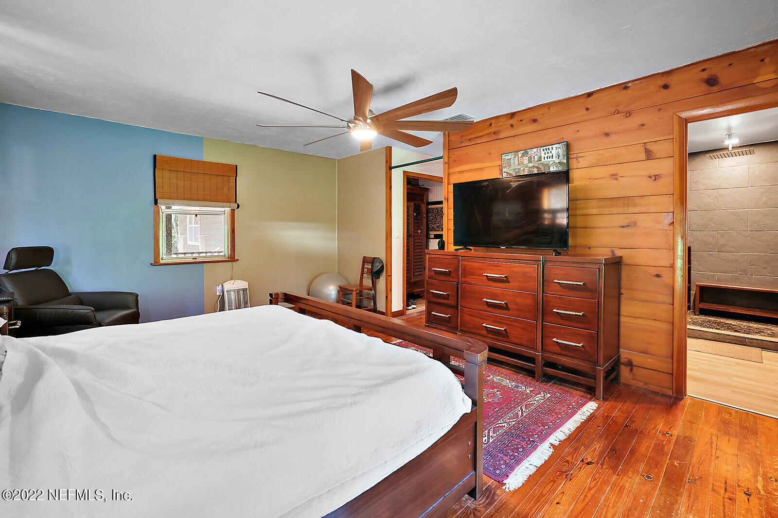 574 Clifton Road Crescent City, FL 32112 - Photo 22 of 38 a bedroom with a bed and a flat screen tv