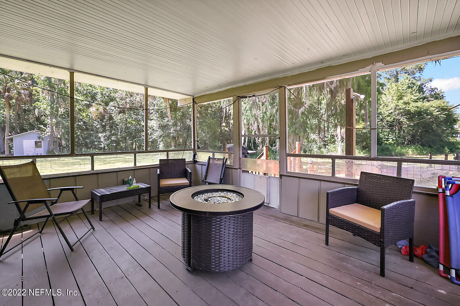 574 Clifton Road Crescent City, FL 32112 - Photo 24 of 38 a living room with furniture and a floor to ceiling window