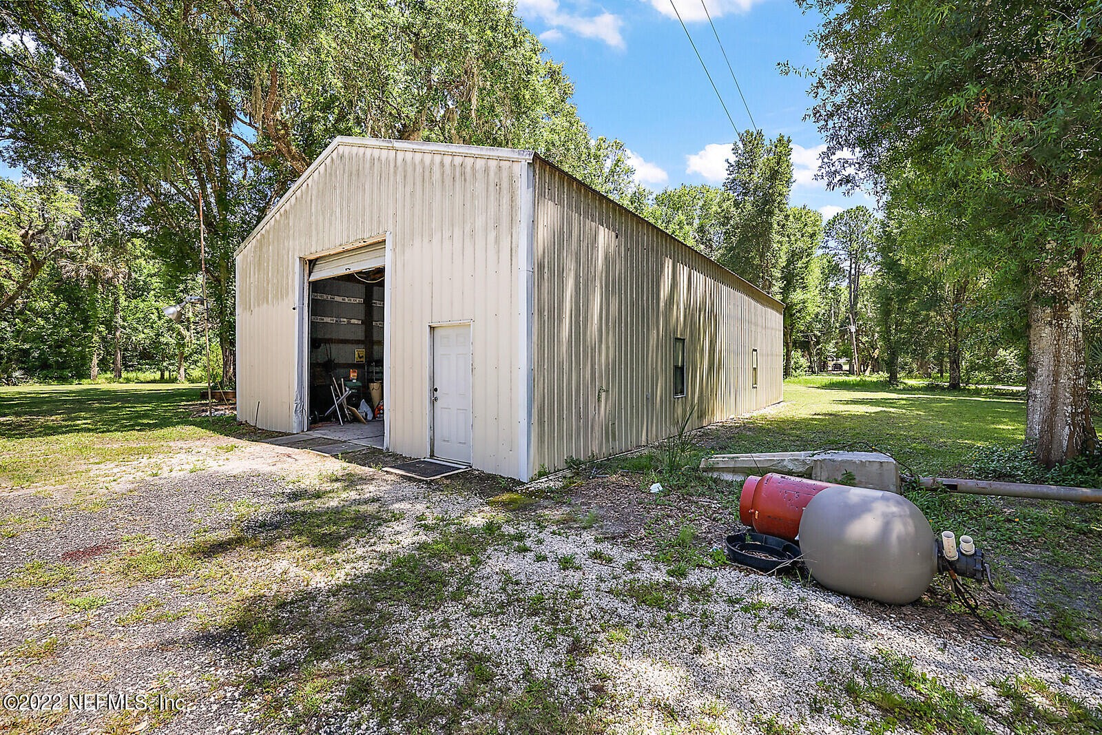 574 Clifton Road Crescent City, FL 32112 - Photo 33 of 38 a view of a house with backyard and a tree