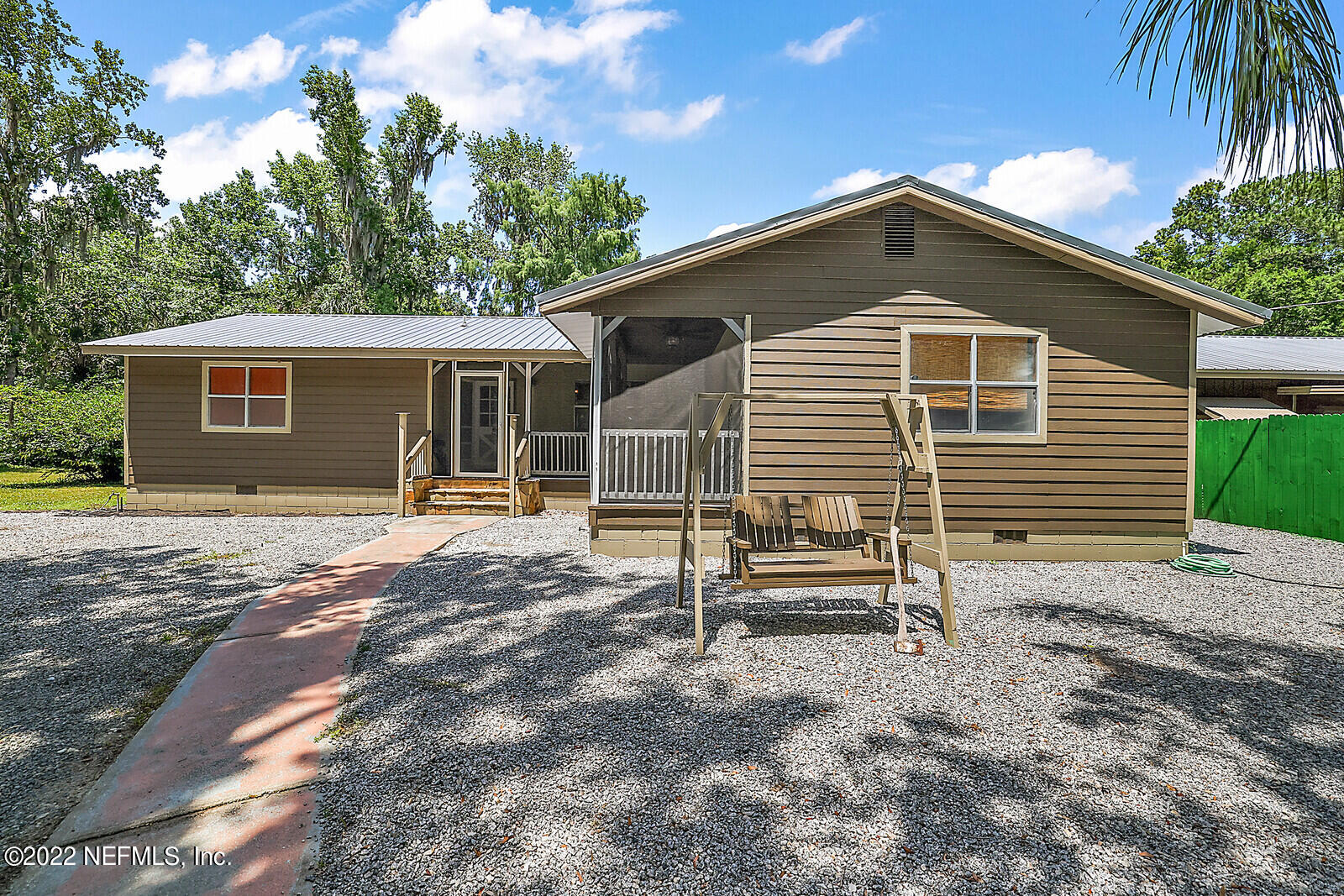 574 Clifton Road Crescent City, FL 32112 - Photo 34 of 38 a front view of a house with a yard