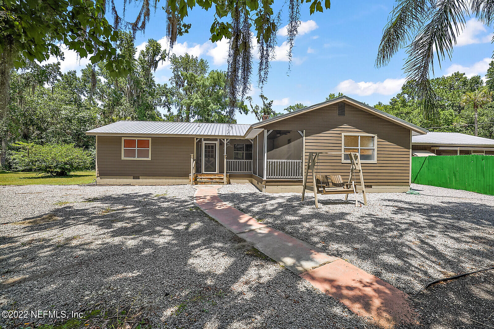 574 Clifton Road Crescent City, FL 32112 - Photo 35 of 38 a front view of a house with a garden