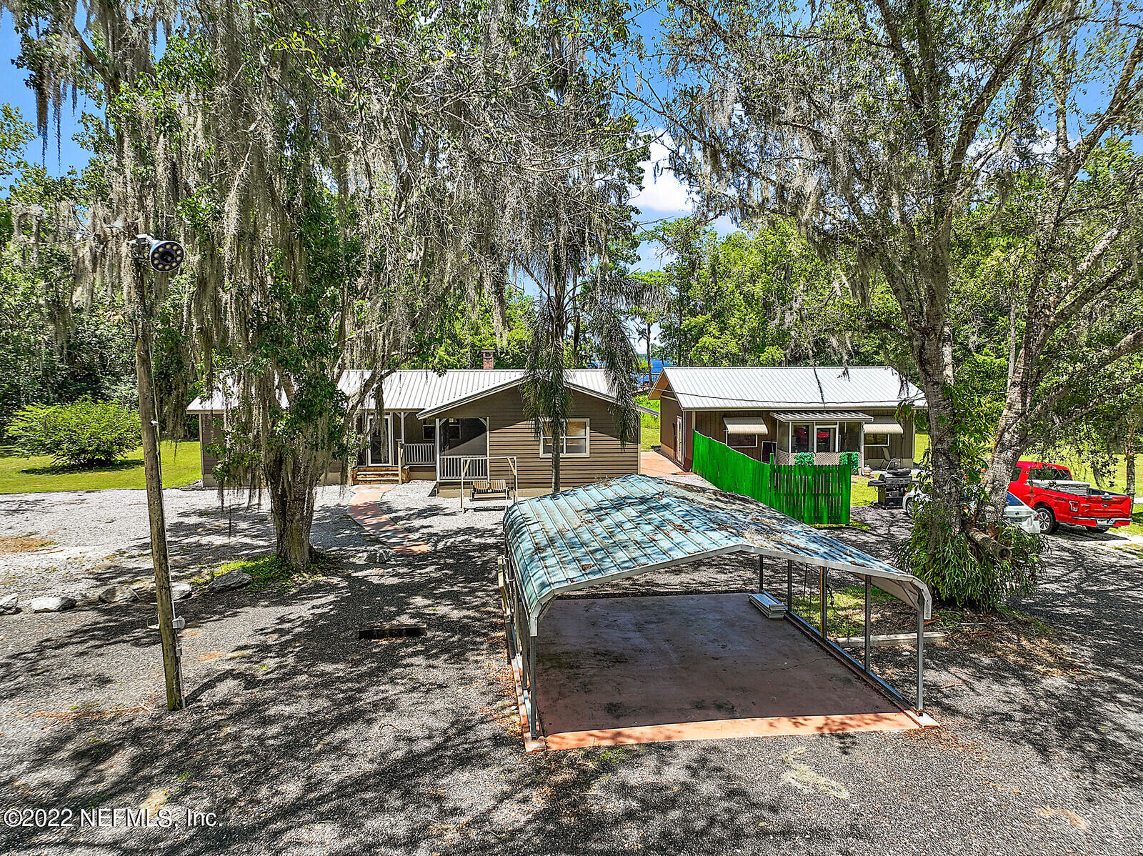574 Clifton Road Crescent City, FL 32112 - Photo 36 of 38 a view of a house with a yard and a tree