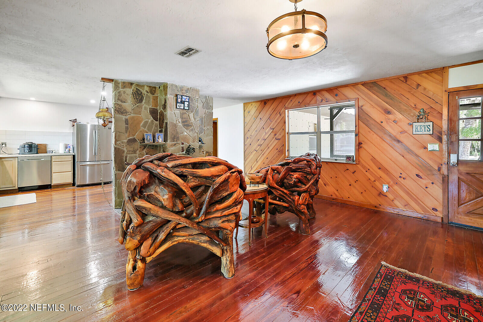 574 Clifton Road Crescent City, FL 32112 - Photo 7 of 38 a view of a room with furniture window and wooden floor
