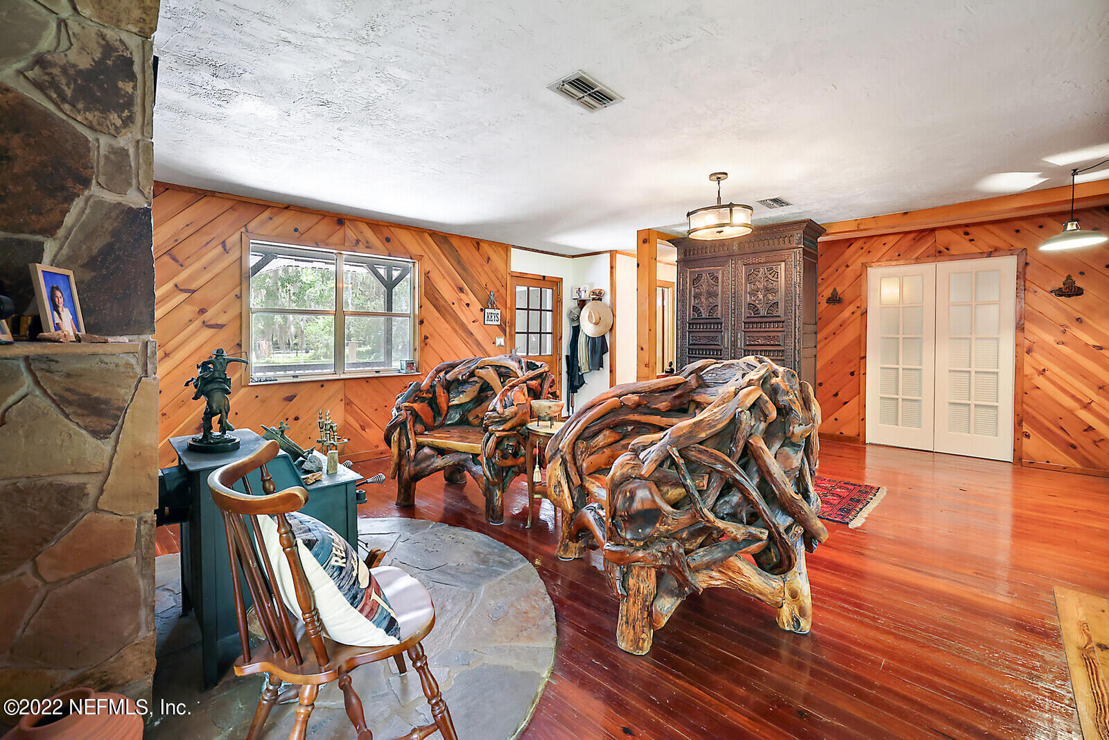 574 Clifton Road Crescent City, FL 32112 - Photo 8 of 38 a view of a livingroom with furniture window and wooden floor