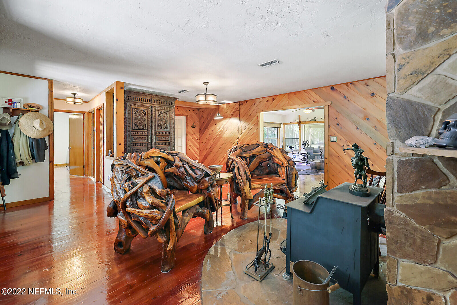574 Clifton Road Crescent City, FL 32112 - Photo 9 of 38 a view of a dining room with furniture window and wooden floor
