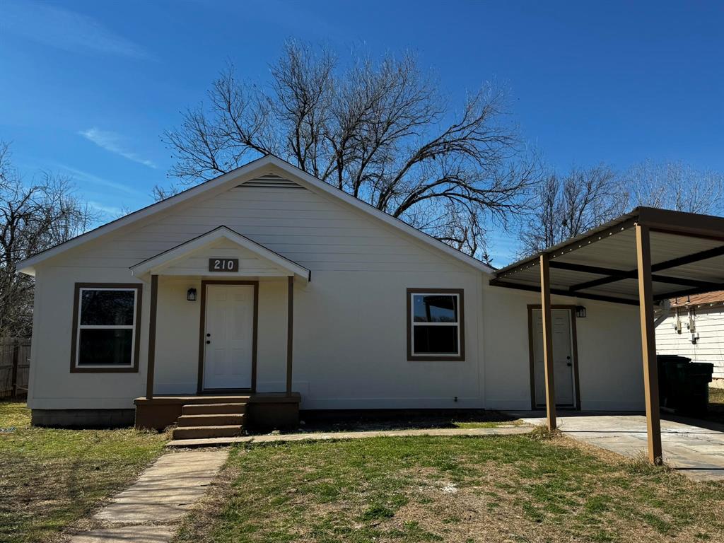 210 Reta Street Stephenville, TX 76401 - Photo 1 of 13 a backyard of a house