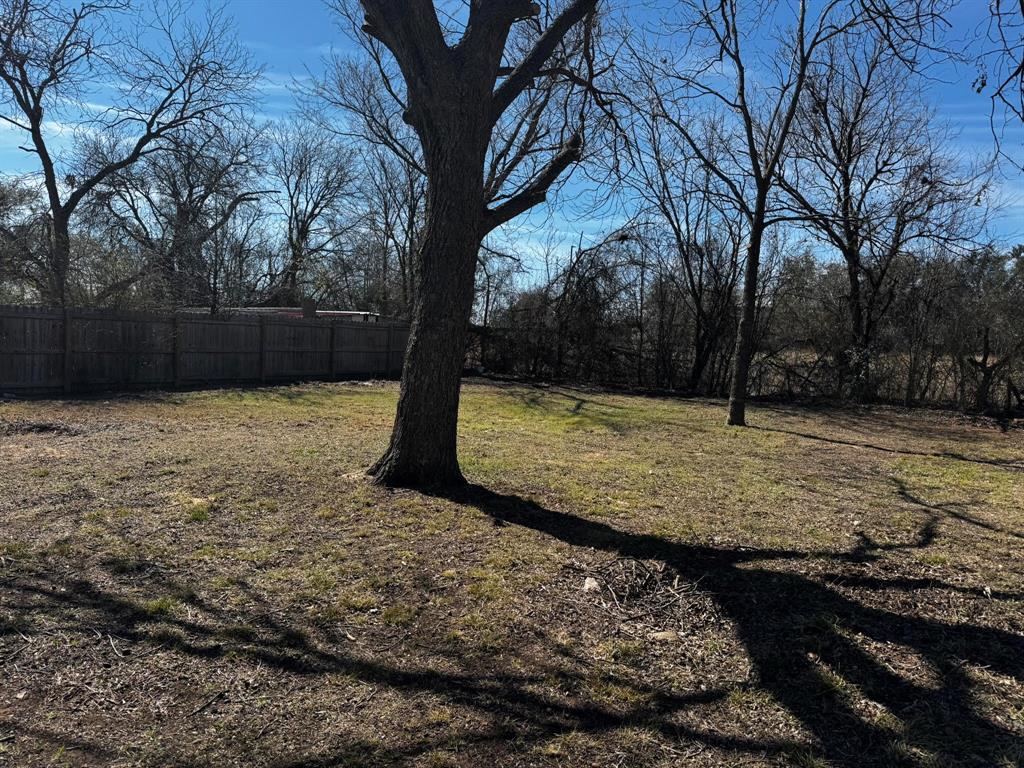 210 Reta Street Stephenville, TX 76401 - Photo 10 of 13 a view of a yard with a tree