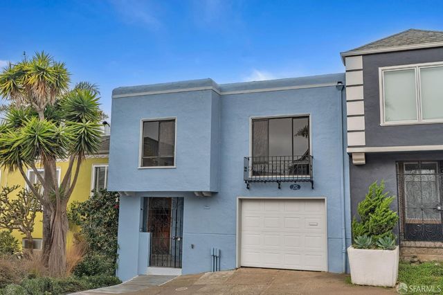 a front view of a house with a garage