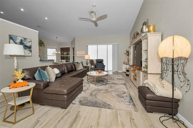 a kitchen with stainless steel appliances kitchen island granite countertop a refrigerator and a stove top oven