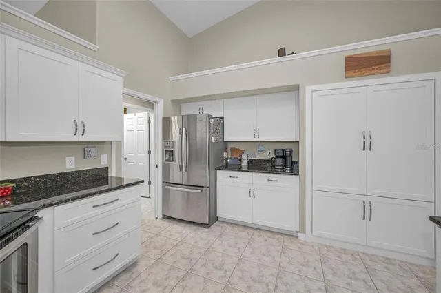 a dining room with furniture window and wooden floor