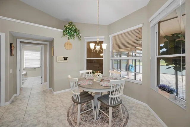 a spacious bathroom with a granite countertop tub sink and mirror