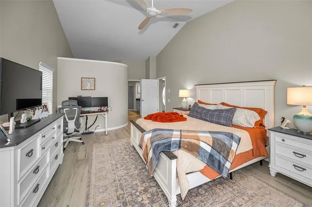 a view of a workspace with furniture and wooden floor