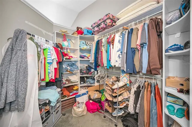 a view of a storage & utility room with a washer dryer