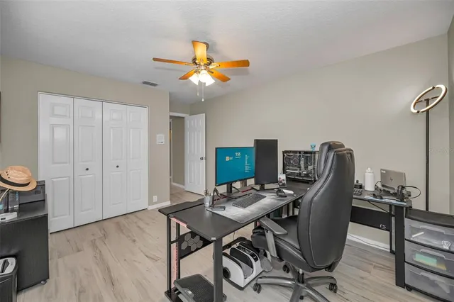 a view of a patio with a table and chairs