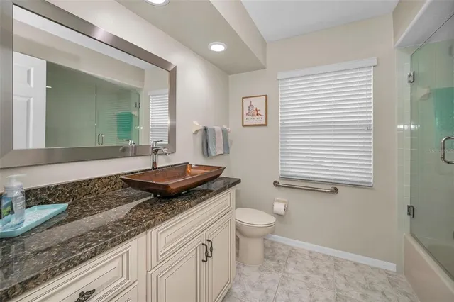 a view of a swimming pool with a patio