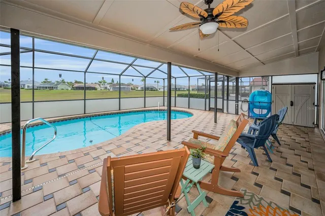 a front view of a house with a yard and fountain in middle