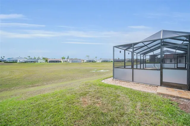 a view of a patio with a table and chairs