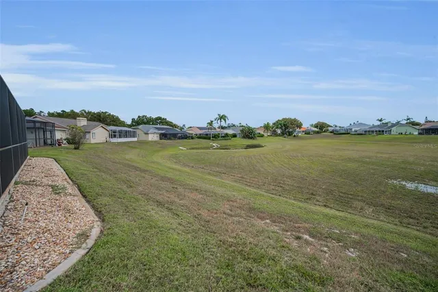 a view of a golf course with a lake