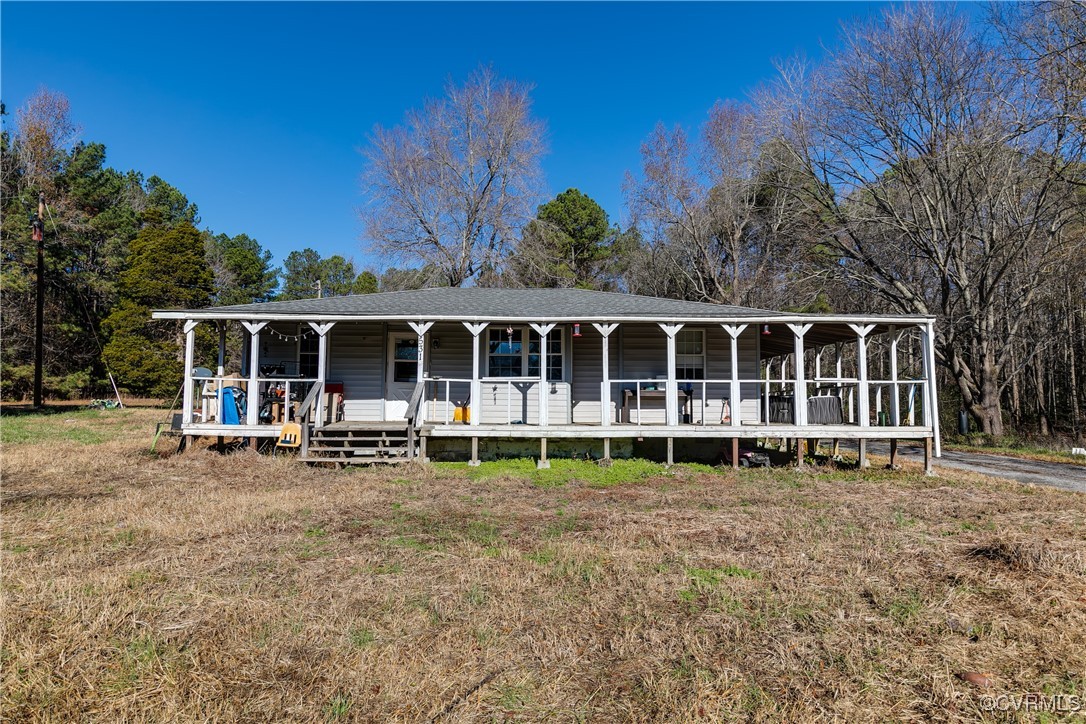 5318 Pine Hill Road Sutherland, VA 23885 - Photo 4 of 16 a front view of a house with a garden