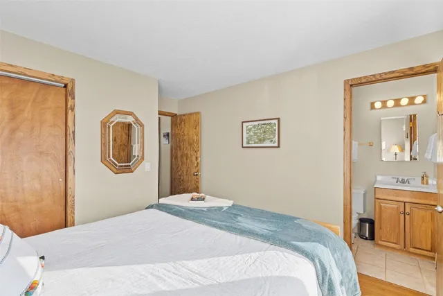 a bedroom with a bed and a cabinets