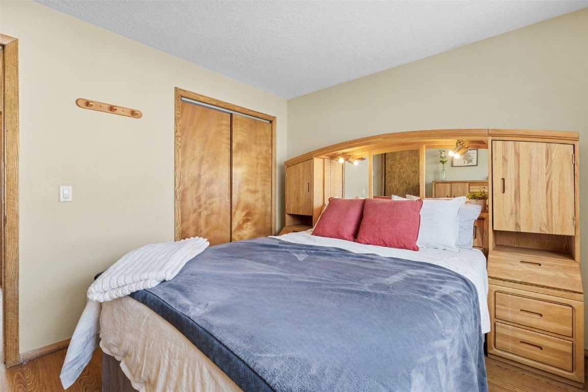 240 La Bonte Street, Unit 47 Dillon, CO 80435 - Photo 25 of 34 a bed sitting in a bedroom next to a window