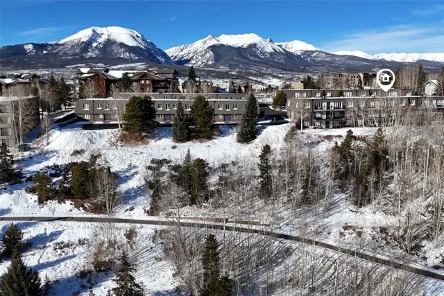 a view of a street with a building in the background