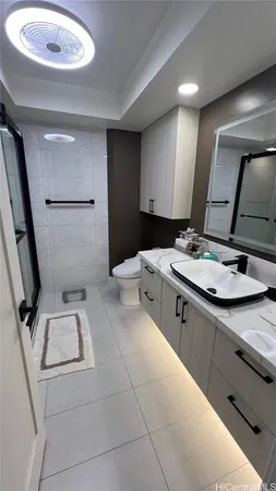 a kitchen with a sink a stove and cabinets