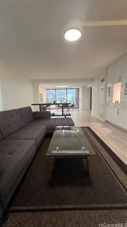 a living room with a couch and a rug