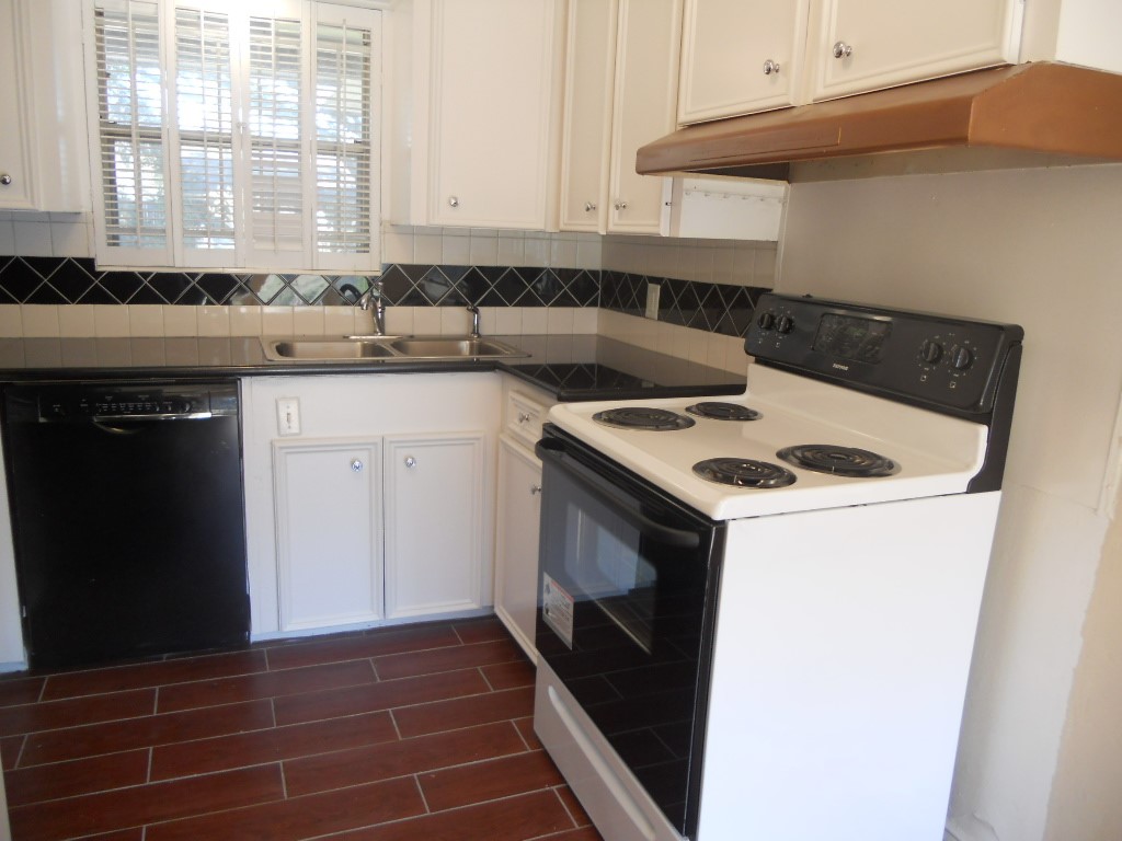 4709 Sanford Road Houston, TX 77035 - Photo 9 of 19 a kitchen with a sink stove and cabinets