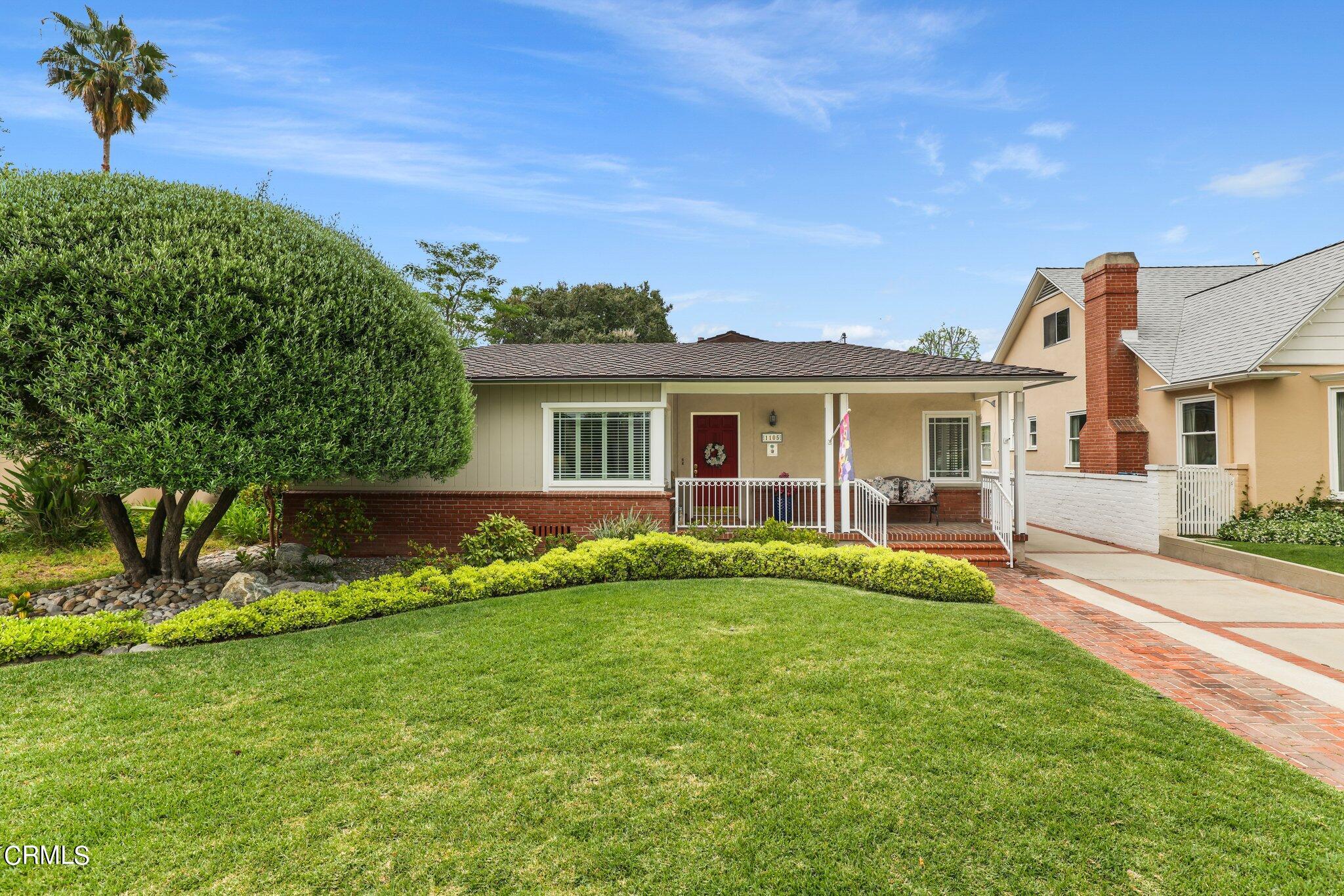 front view of a house with a yard