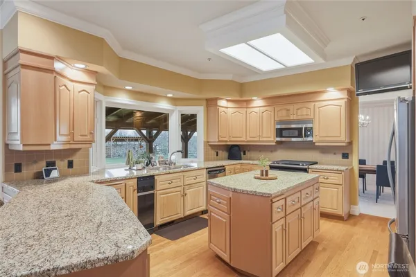 a kitchen with a sink stove and refrigerator