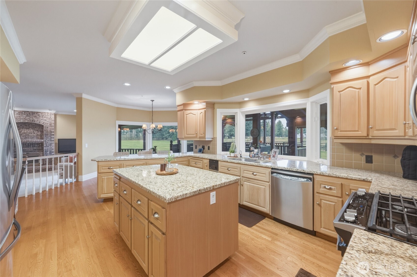 7349 Old Guide Road Ferndale, WA 98248 - Photo 14 of 40 a kitchen with stainless steel appliances granite countertop a sink and a stove